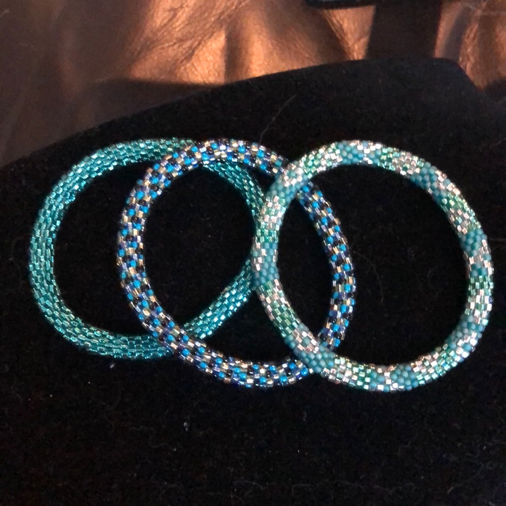 Three bracelets. Green with blue
